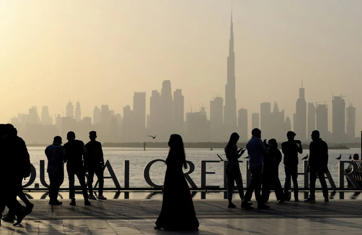 People enjoy their weekend with the view of city skyline and the world tallest tower, Burj Khalifa, in Dubai, United Arab Emirates, on Jan. 29, 2021. (Kamran Jebreili/AP Photo)