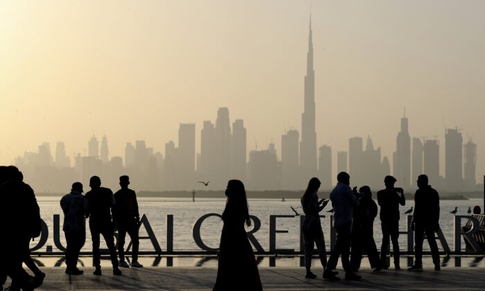 People enjoy a weekend with views of the city skyline and the world's tallest tower, the Burj Khalifa, in Dubai, United Arab Emirates on January 29, 2021.  (Kamran Jebreili/AP Photo)