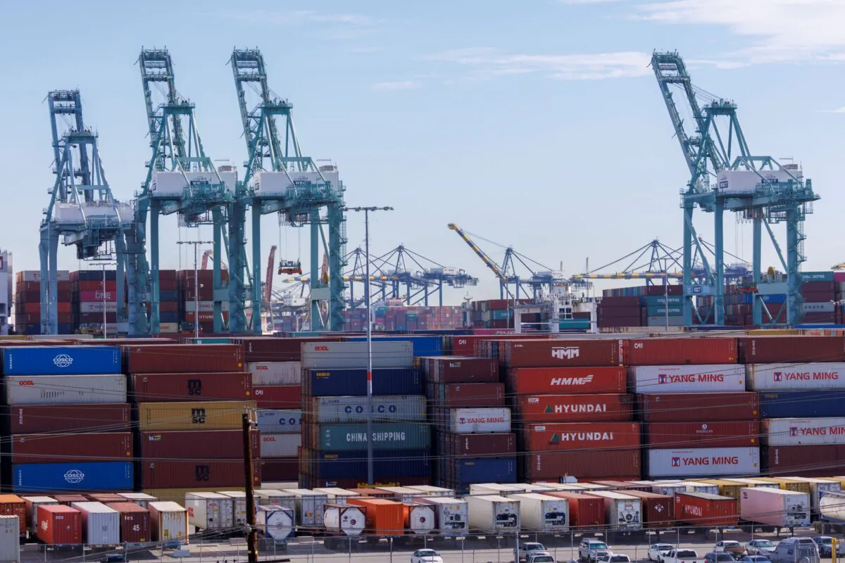 Stacked containers and cranes are shown at the Port of Los Angeles in Los Angeles, Calif., on Nov. 22, 2021. (Mike Blake/Reuters)