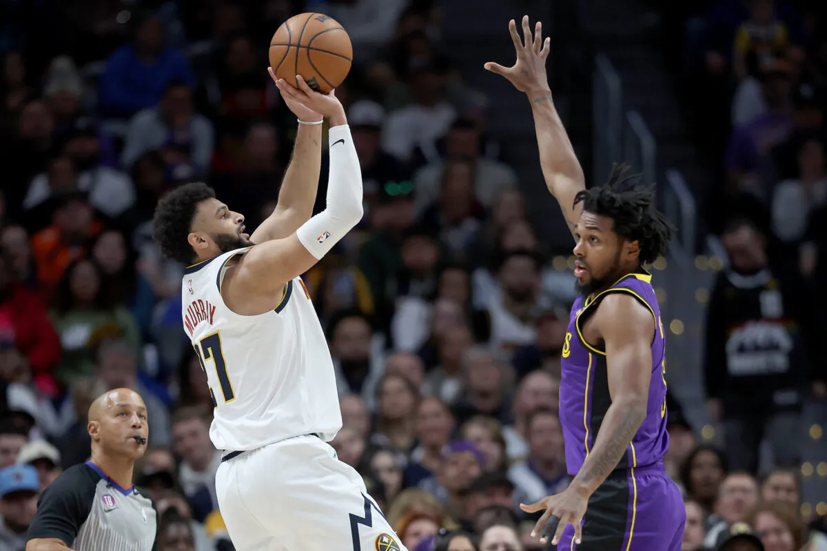 Jamal Muray (27) of the Denver Nuggets puts up a shot over Sterling Brown (23) of the Los Angeles Lakers in the fourth quarter at Ball Arena in Denver on Jan. 9, 2023. (Matthew Stockman/Getty Images)