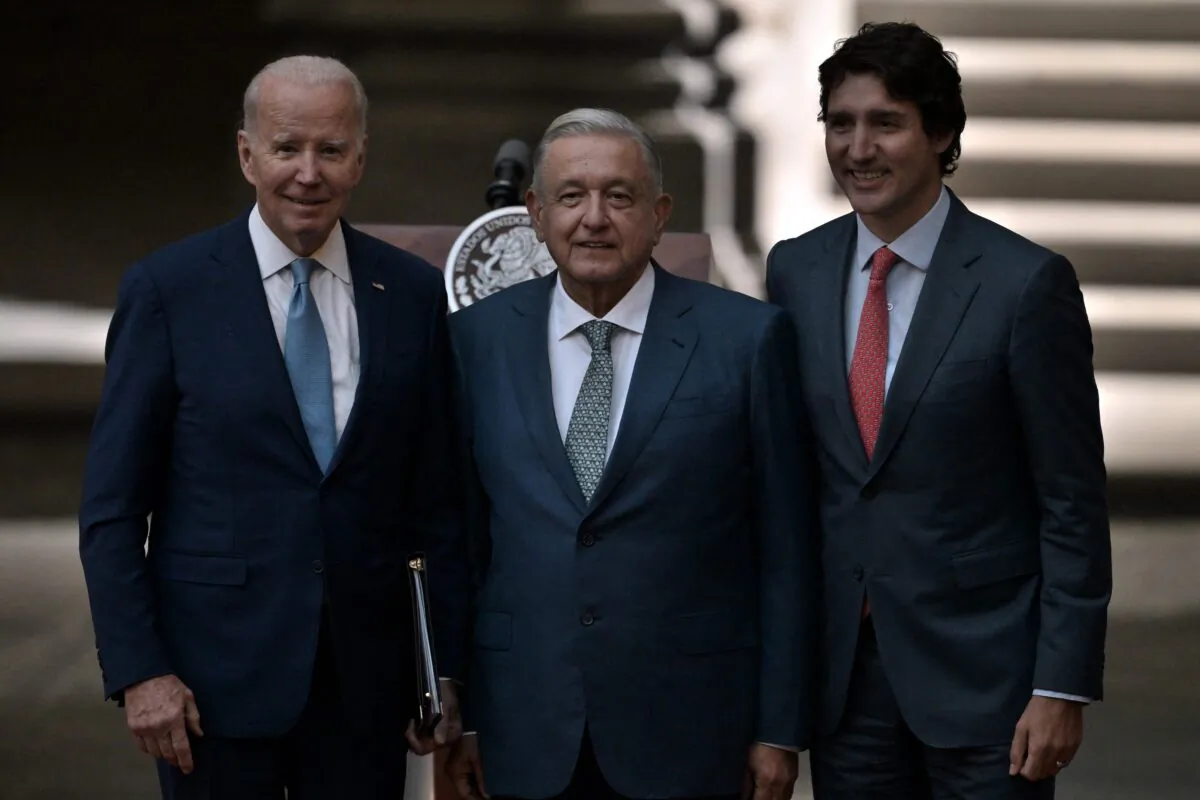 (L-R) U.S. President Joe Biden, Mexican President Andres Manuel Lopez Obrador and Canadian Prime Minister Justin Trudeau pose for pictures after speaking to the press during the 10th North American Leaders Summit at the National Palace in Mexico City on Jan. 10, 2023. (Nicolas Asfouri/AFP via Getty Images)