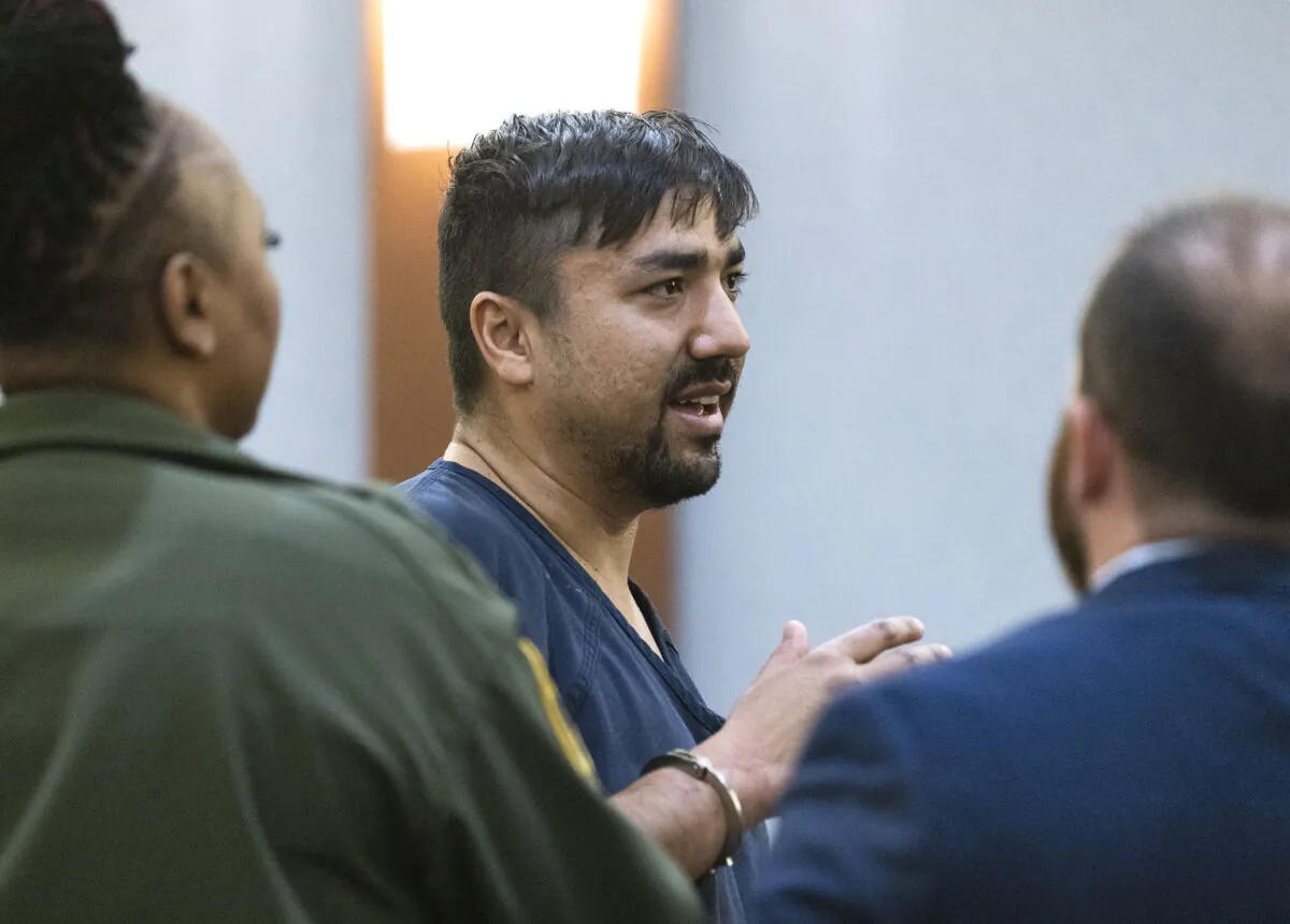 Mohammed Mesmarian is led out of the courtroom after he interrupted the court proceedings before his case being called during his arraignment at the Regional Justice Center in Las Vegas on Jan. 10, 2023. (Bizuayehu Tesfaye/Las Vegas Review-Journal via AP)