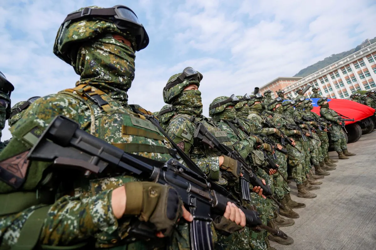 Soldiers stand guard after a preparedness enhancement drill simulating the defense against Beijing's military intrusions, ahead of the Lunar New Year in Kaohsiung City, Taiwan, on Jan 11, 2023. (Daniel Ceng/AP Photo)