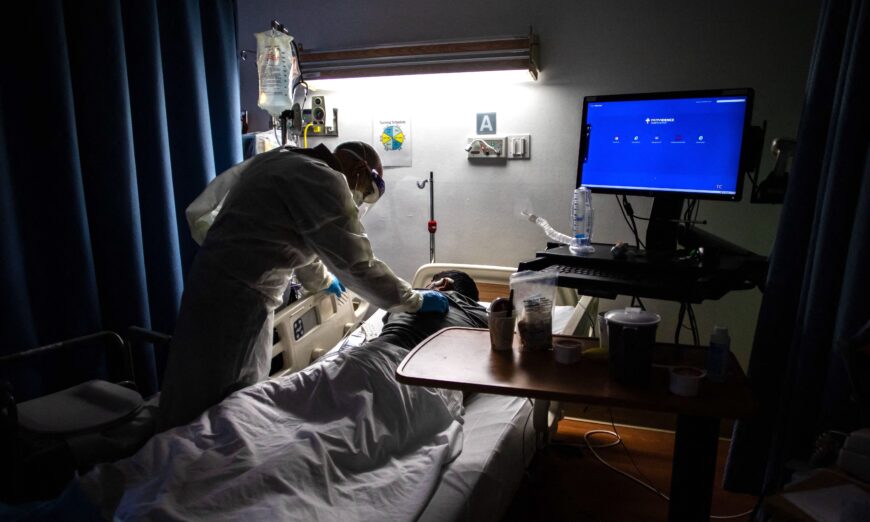 A doctor checks on a 34-year-old COVID-19 patient at a medical center in Tarzana, Calif., on Sept. 2, 2021. (Apu Gomes/AFP via Getty Images)