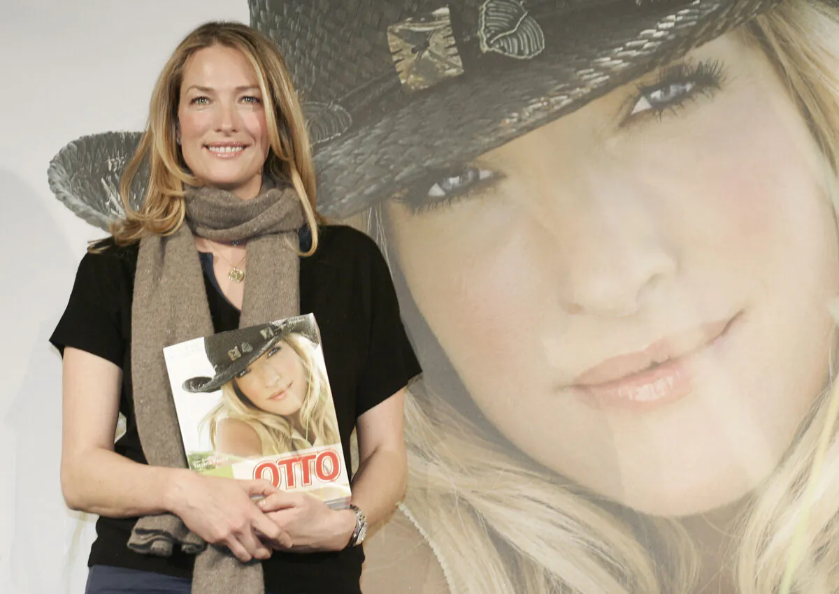 German model Tatjana Patitz poses with the new catalog of German catalog company Otto during a photocall in Hamburg, Germany, on Dec. 14, 2006. (Fabian Bimmer/AP Photo)