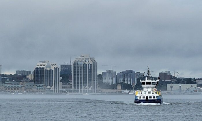 A passenger ferry, operated by Halifax Transit, makes its way across the Halifax harbour to the Woodside ferry terminal in Dartmouth, N.S., on Aug. 2, 2022. (The Canadian Press/Doug Ives)
