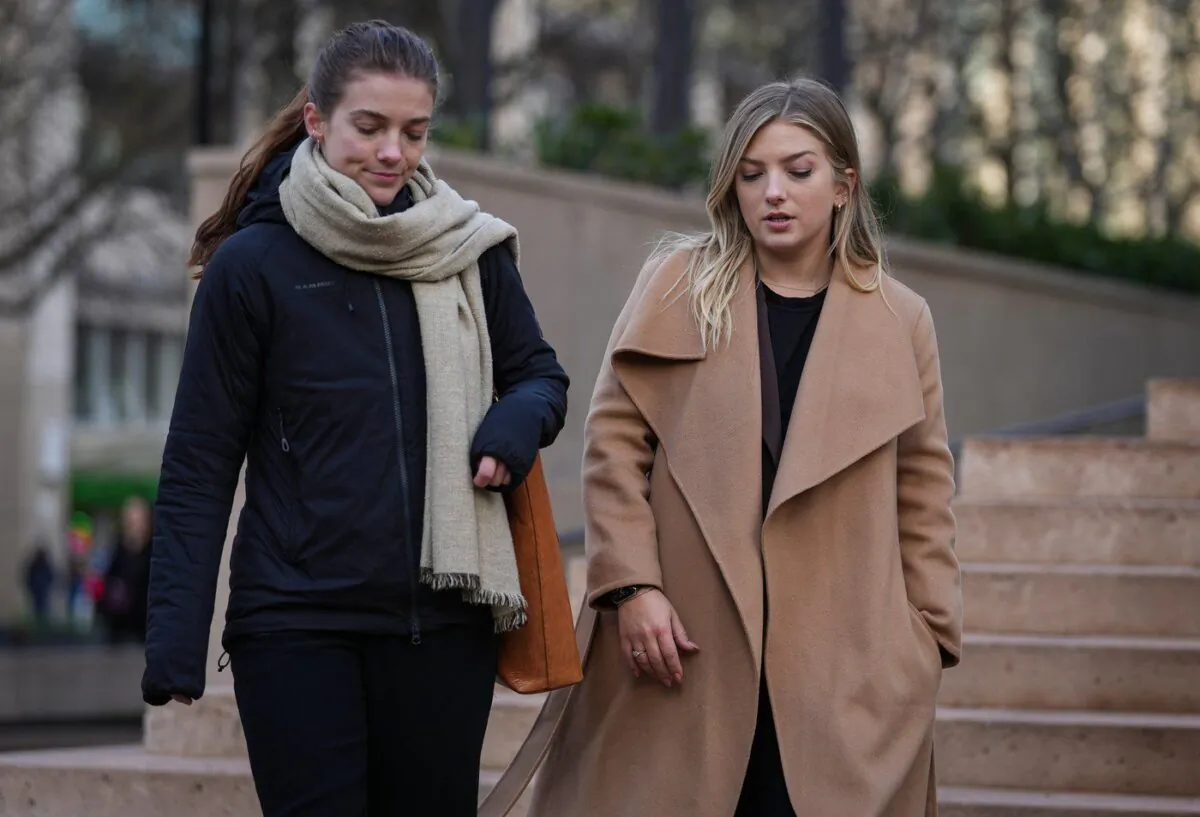 Jessica Payne, left, and her sister Calla Payne leave B.C. Supreme Court in Vancouver, B.C., Dec. 15, 2022. (The Canadian Press/Darryl Dyck)