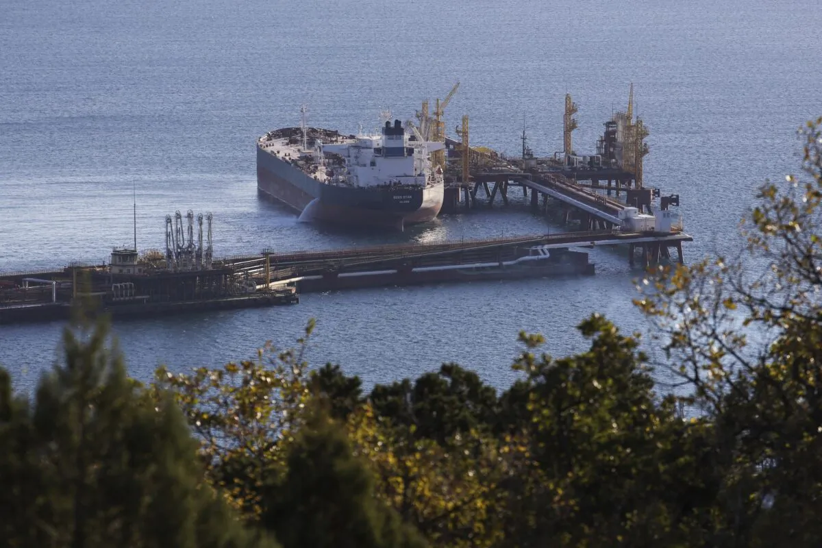 An oil tanker is moored at the Sheskharis complex, part of Chernomortransneft JSC, a subsidiary of Transneft PJSC, the largest facilities for oil and petroleum products in southern Russia, in Novorossiysk on Oct. 11, 2022. (AP Photo)