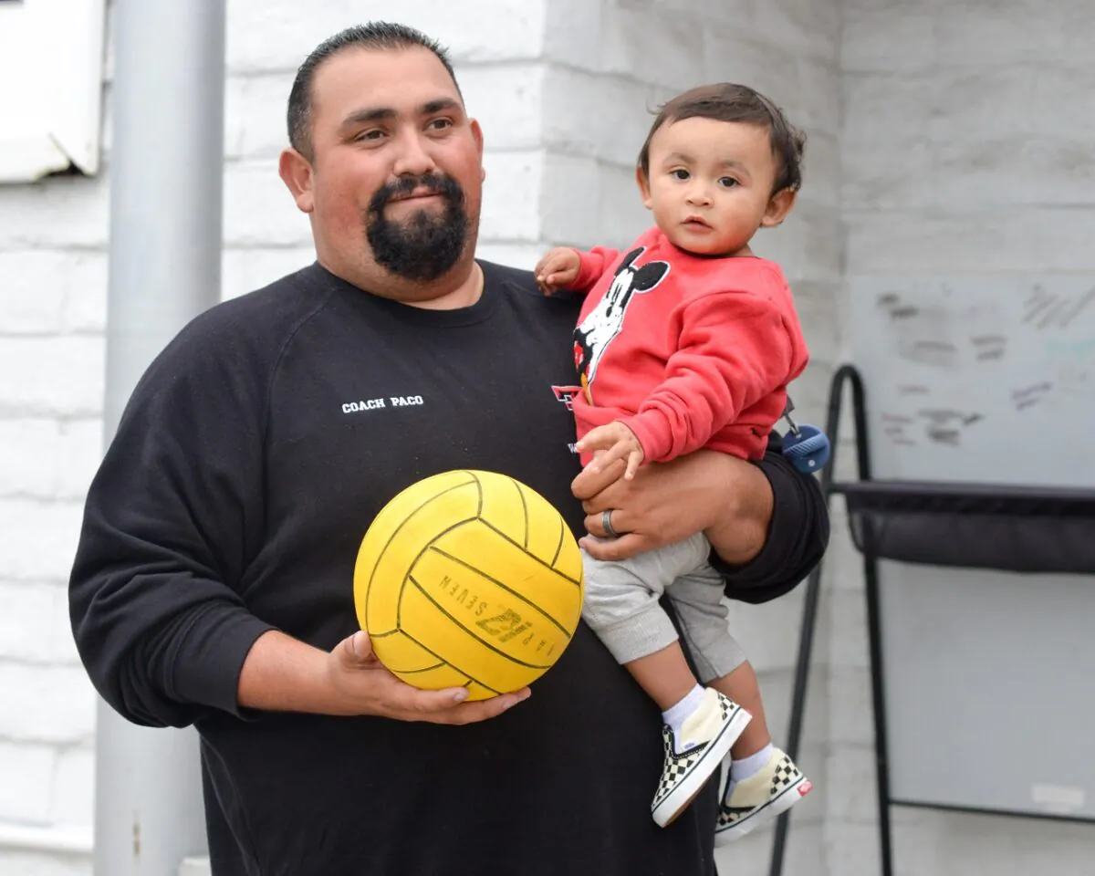 Francisco “Paco” Gonzalez with his son near a pool. (Courtesy of Mai Lam)