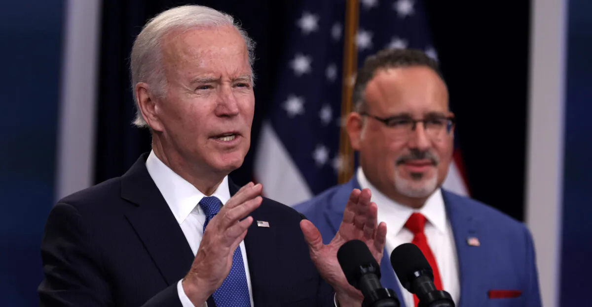 President Joe Biden speaks on a previous student debt relief scheme as Education Secretary Miguel Cardona looks on in Washington on Oct. 17, 2022. (Alex Wong/ Getty Images)