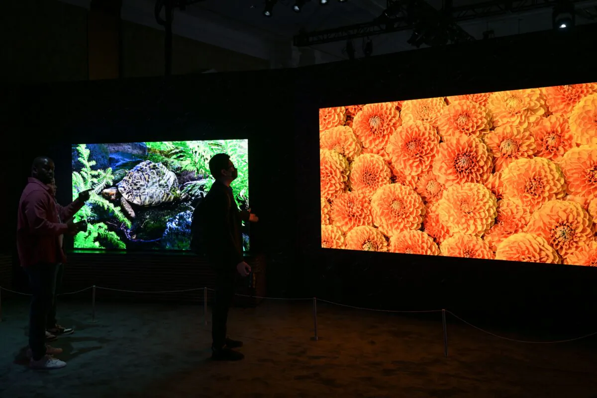 Attendees view Samsung Electronics Co.s Micro LED TVs displayed during a media preview ahead of the Consumer Electronics Show (CES) of Las Vegas, Nevada on Jan. 3, 2023. (Patrick T. Fallon / AFP via Getty Images)
