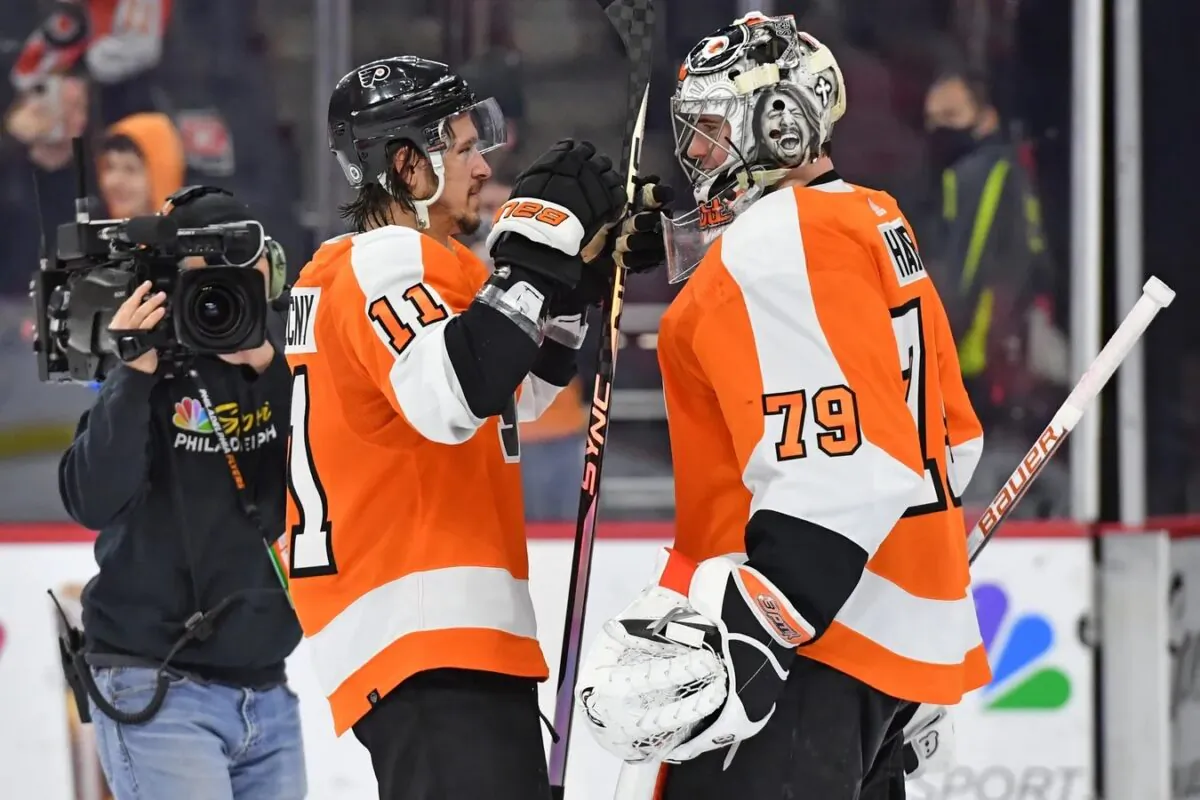 Philadelphia Flyers right wing Travis Konecny (11) and goaltender Carter Hart (79) celebrate win against the Washington Capitals at Wells Fargo Center in Philadelphia on Jan. 11, 2023. (Eric Hartline-USA TODAY Sports via Field Level Media)