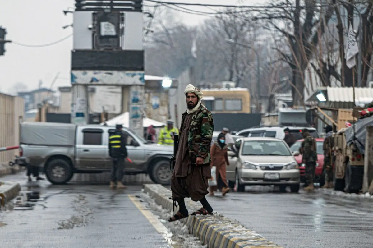 A Taliban extremist stands guard on a blocked road after a suicide blast near Afghanistan's foreign ministry at the Zanbaq Square in Kabul on Jan. 11, 2023. (Wakil Kohsar/AFP via Getty Images)
