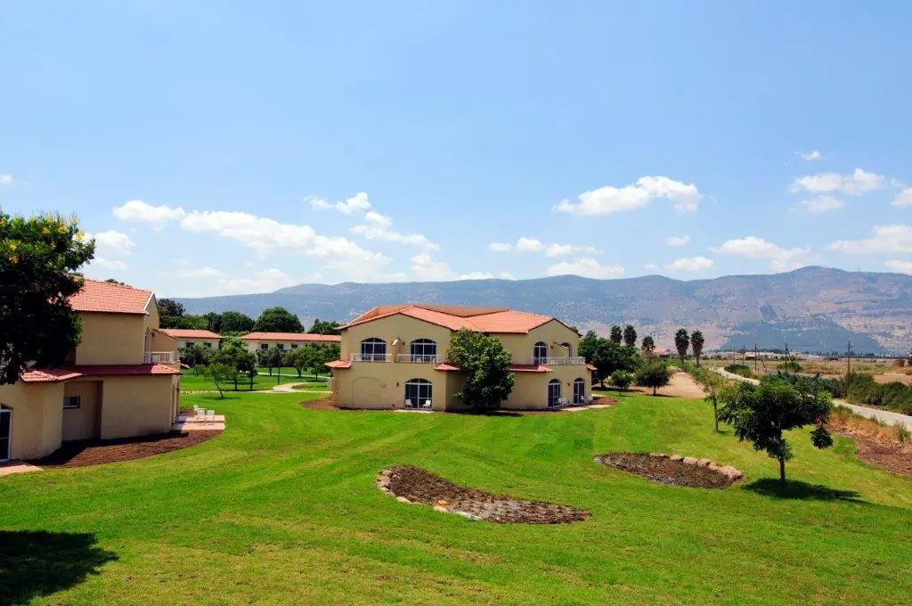 Kfar Blum, a kibbutz in northern Israel, began as a collective farm run on socialist principles. As times changed, so did Kfar Blum and other kibbutzes, going into businesses like Kfar Blum's hotel pictured here. As they did, they found they had to become less socialist. (Courtesy of Kfar Blum.) 