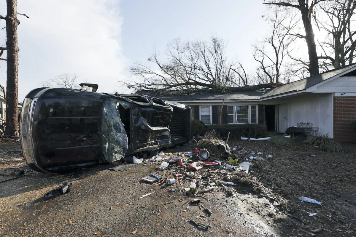 A vehicle is upended and debris is strewn about follow a tornado that hit Selma, Ala., on Jan. 12, 2023. (Butch Dill/ AP Photo)