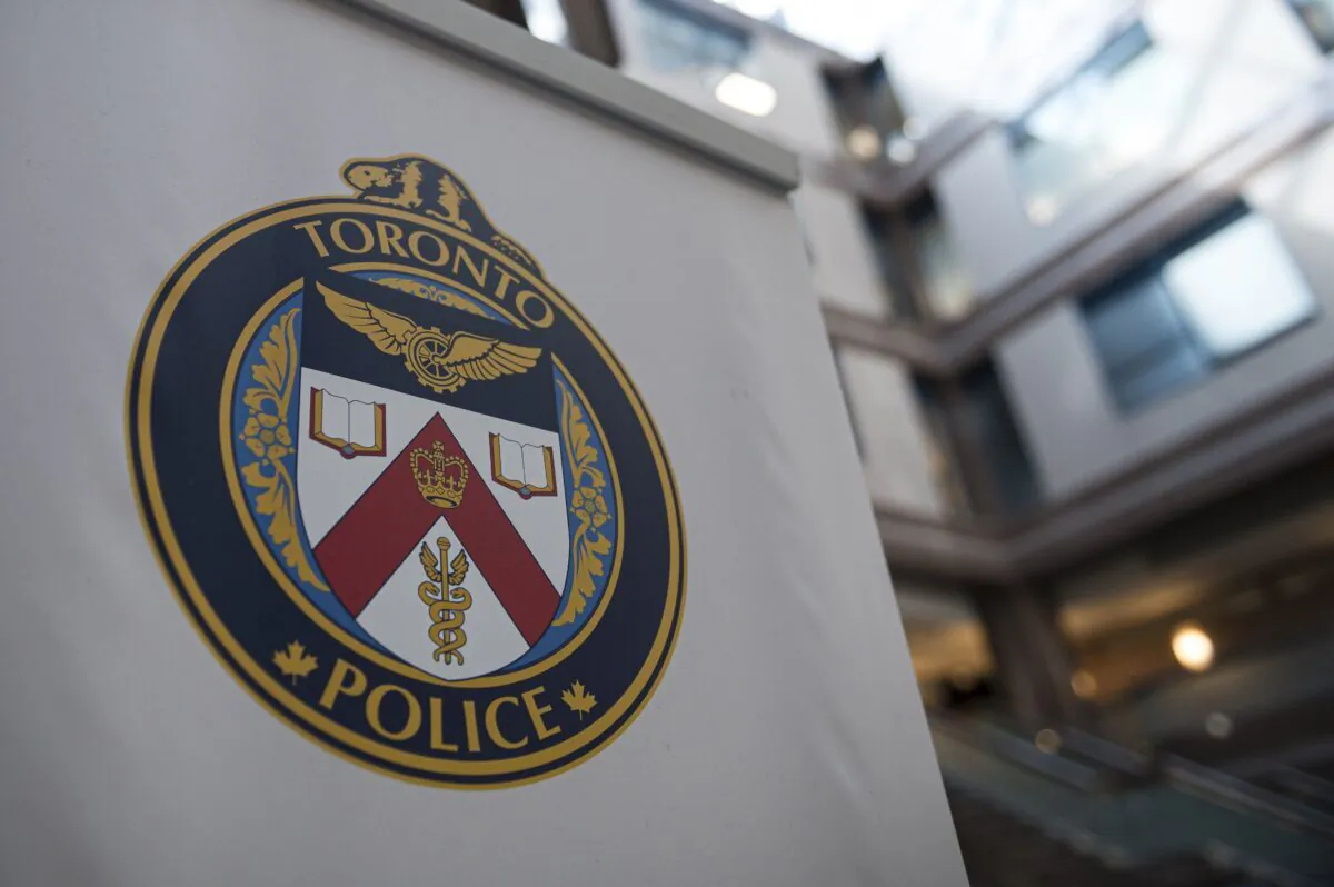 A Toronto Police Services logo is shown at headquarters in Toronto on Aug. 9, 2019. (Christopher Katsarov/The Canadian Press)