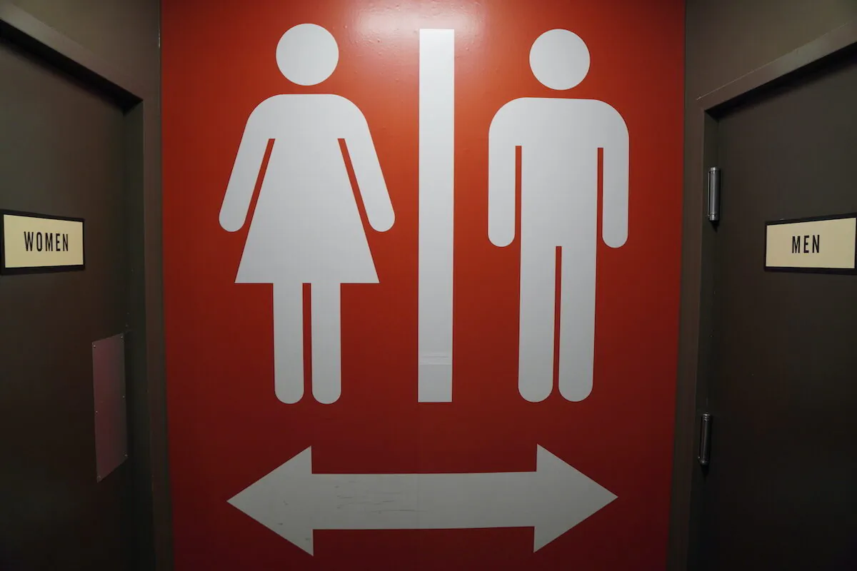 A sign outside restrooms in Chattanooga, Tenn. on Jan. 13, 2023, seems to indicate that women and men should use separate facilities. (Jackson Elliott/The Epoch Times)