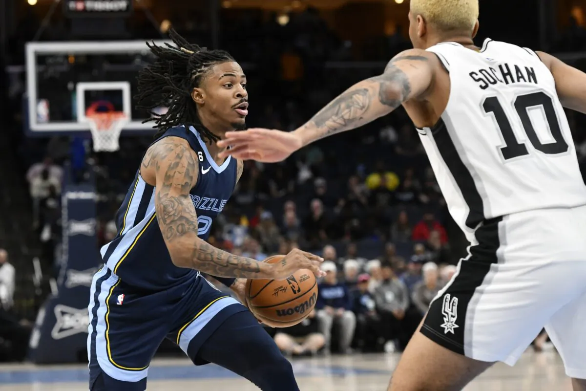 Memphis Grizzlies guard Ja Morant drives against San Antonio Spurs forward Jeremy Sochan (10) during the first half of an NBA basketball game in Memphis, Tenn., on Jan. 11, 2023. (Brandon Dill/AP Photo)