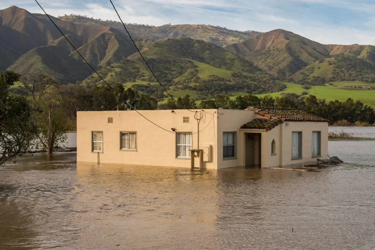 A house is submerged in floodwaters from the Salinas River near Chualar, Calif., on Jan. 12, 2023. (Nic Coury/AFP via Getty Images)