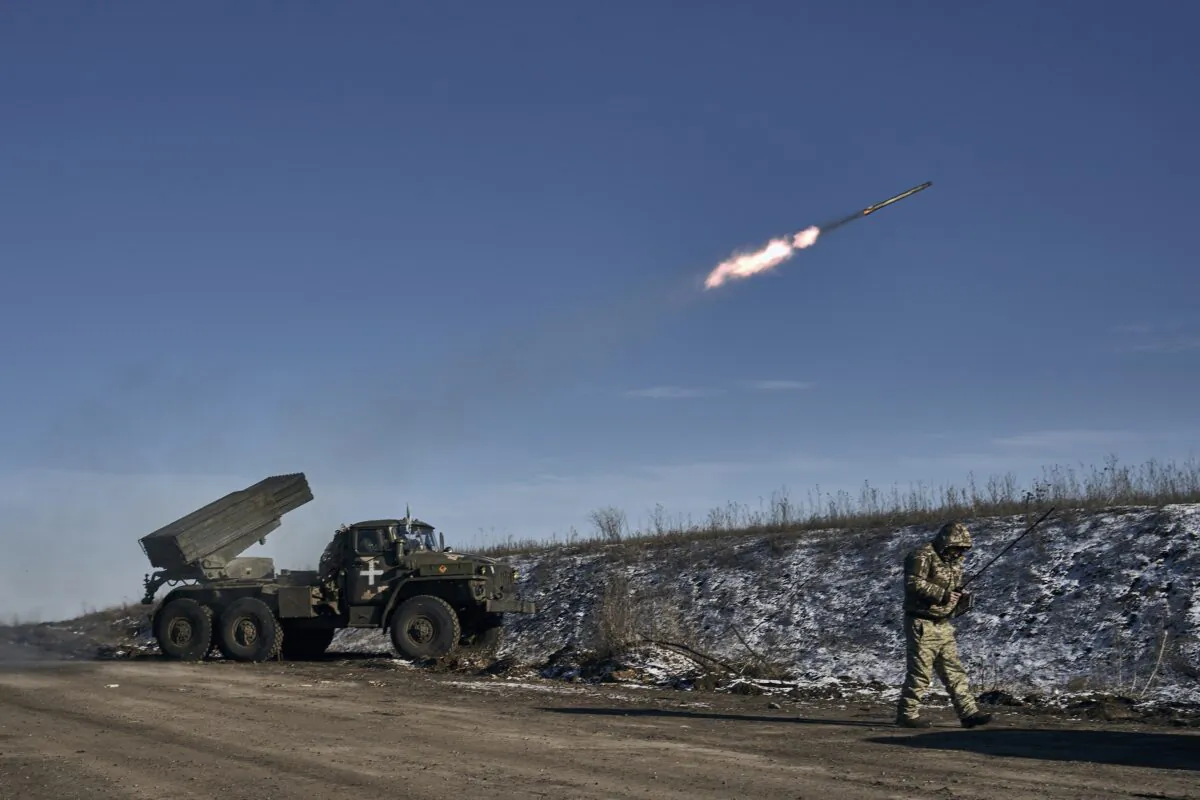 Ukrainian army Grad multiple rocket launcher fires rockets at Russian positions in the frontline near Soledar, Donetsk region, Ukraine, on Jan. 11, 2023. (Libkos/AP Photo)
