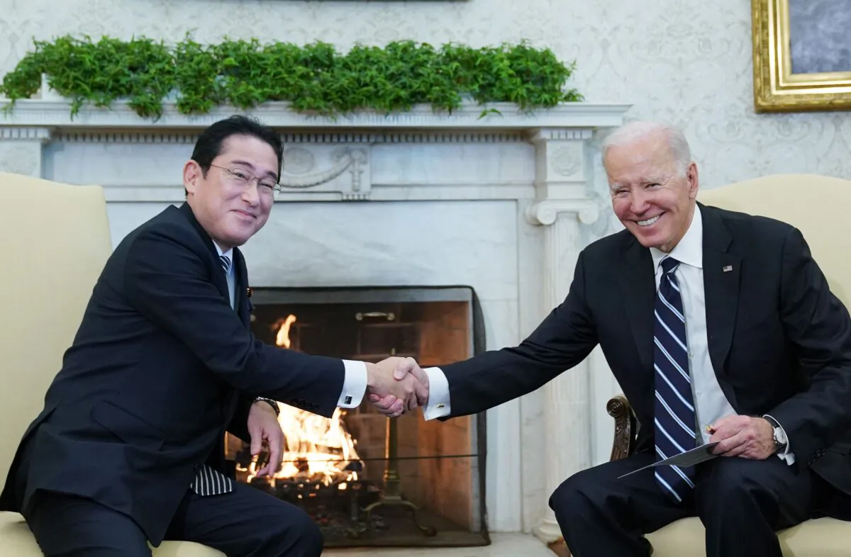U.S. President Joe Biden shakes hands with Japan's Prime Minister Fumio Kishida during a meeting in the Oval Office of the White House in Washington on Jan. 13, 2023. (Mandel Ngan/AFP via Getty Images)