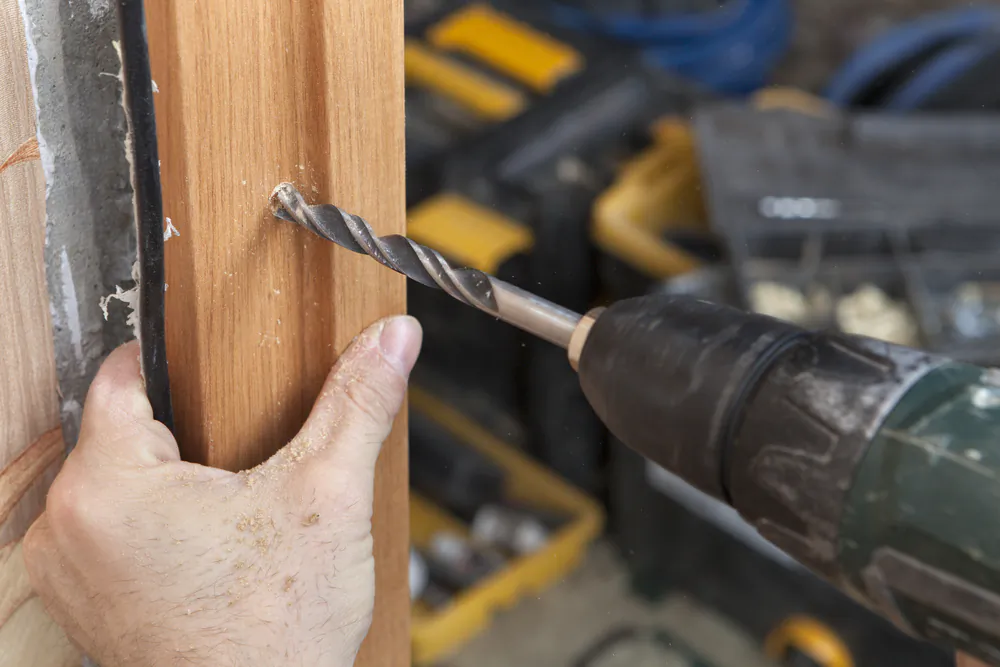 A jamb shield strengthens the weakest point of the door frame, such as the frame, hinge, and lock areas.(Grigvovan/Shutterstock)