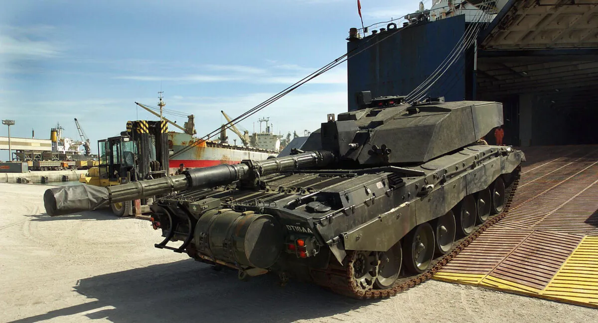 The first British Challenger 2 main battle tanks roll off of their transport ship after arriving from Germany at Camp Commando, Kuwait, in February 2003. (WO2 Giles Penfound/MOD/Getty Images)