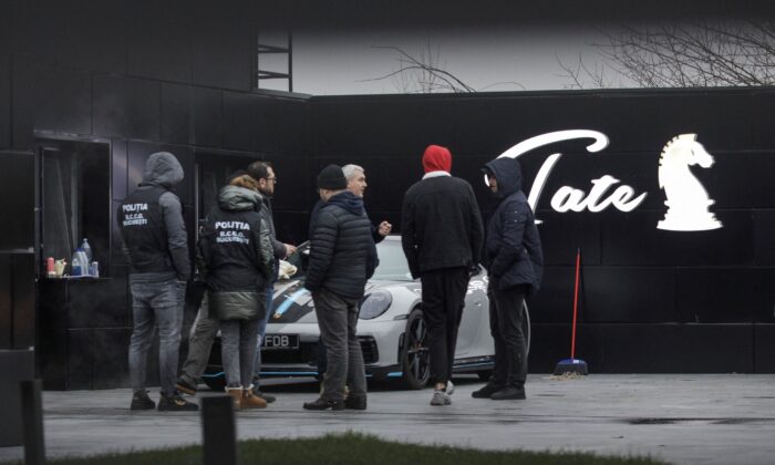 Romanian officials transport the cars seized from Andrew Tate's compound to a storage location in Pipera, Ilfov, Romania, on Jan. 14, 2023. (Inquam Photos/Octav Ganea via Reuters)