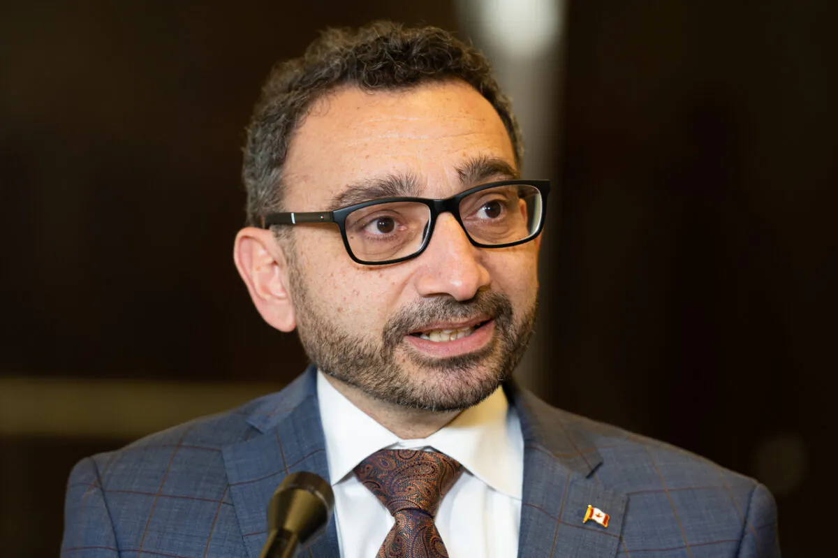 Federal Transport Minister Omar Alghabra speaks with reporters before appearing as a witness at a House of Commons Standing Committee on Transport, Infrastructure, and Communities in Ottawa on Jan. 12, 2023. (The Canadian Press/Spencer Colby)