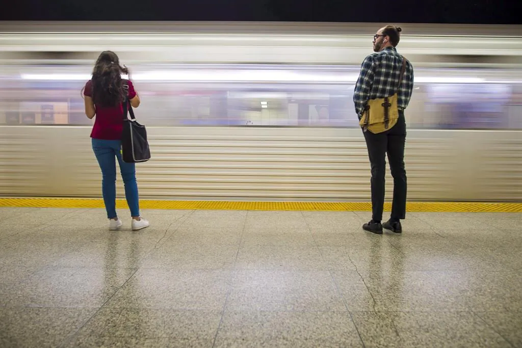 Commuters wait to take the subway at Ossington Station in Toronto on June 22, 2018. (The Canadian Press/Tijana Martin)