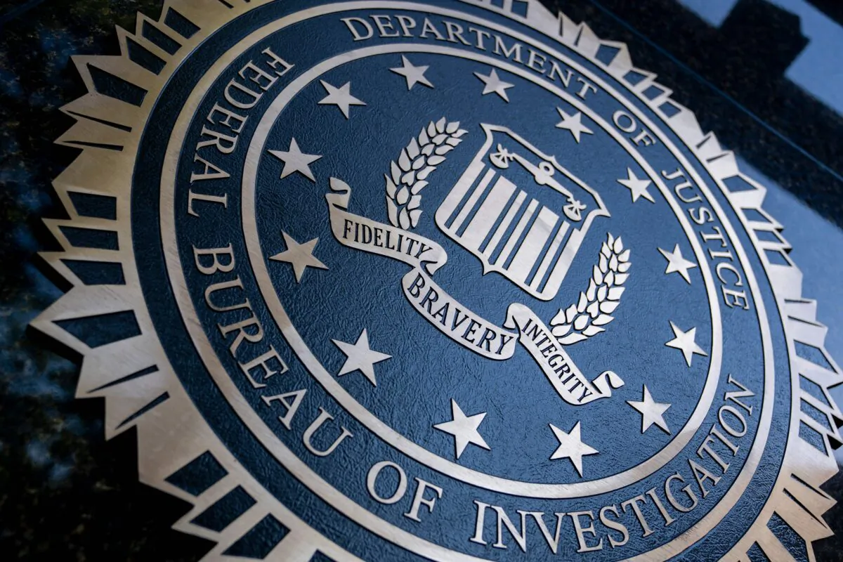 A seal reading "Department of Justice Federal Bureau of Investigation" is displayed on the J. Edgar Hoover FBI building in Washington, on Aug. 9, 2022. (Stefani Reynolds/AFP via Getty Images)