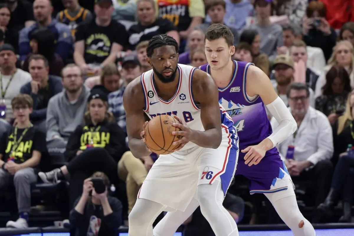 Philadelphia 76ers center Joel Embiid (21) keeps the ball away from Utah Jazz center Walker Kessler (24) during the second half at Vivint Arena in Salt Lake City on Jan. 14, 2023. (Chris Nicoll/USA TODAY Sports via Field Level Media)