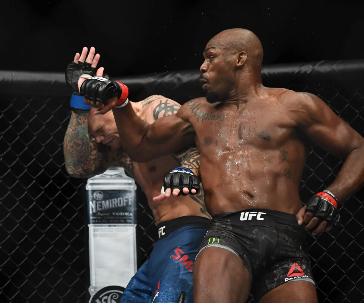 Jon Jones (red gloves) and Anthony Smith (blue gloves) during UFC 235 at T-Mobile Arena in Las Vegas on March 2, 2019. (Stephen R. Sylvanie/USA TODAY Sports via Reuters)