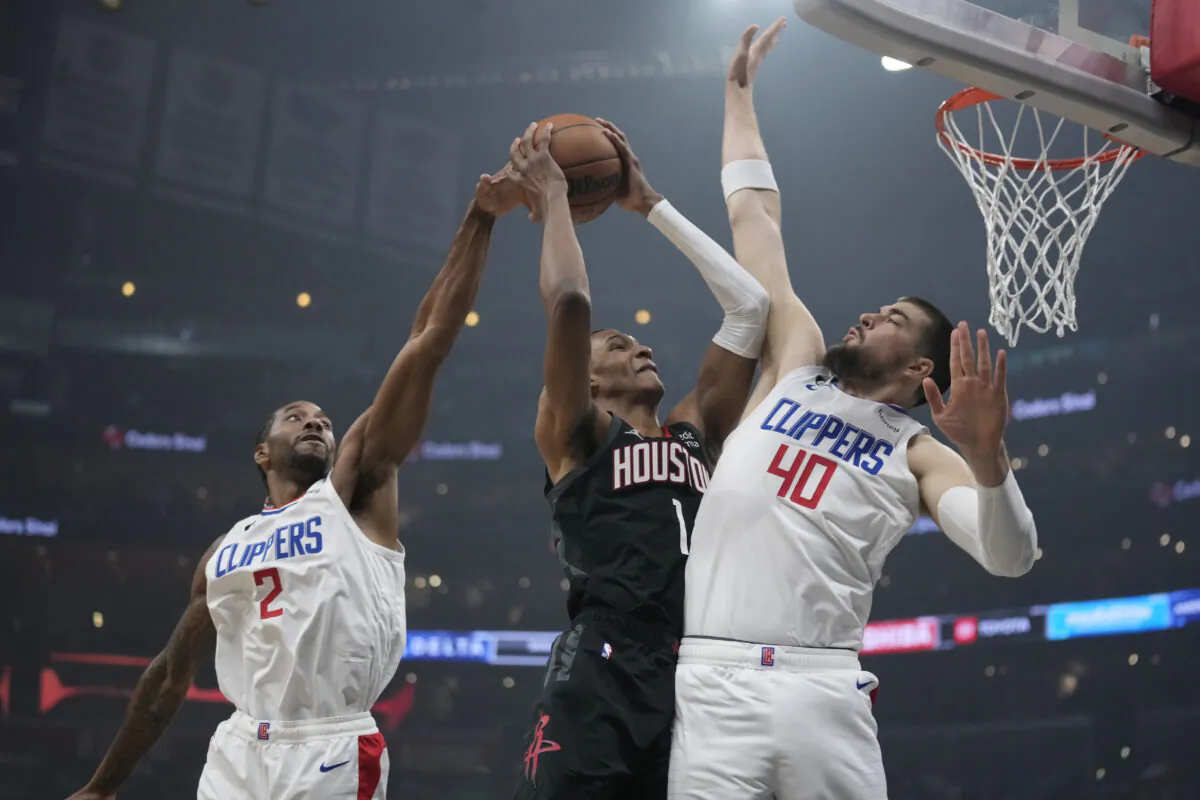 Houston Rockets forward Jabari Smith Jr. (1) is fouled by Los Angeles Clippers center Ivica Zubac (40) as he drives to the basket during the first half of an NBA basketball game in Los Angeles on Jan. 15, 2023. (Marcio Jose Sanchez/AP Photo)