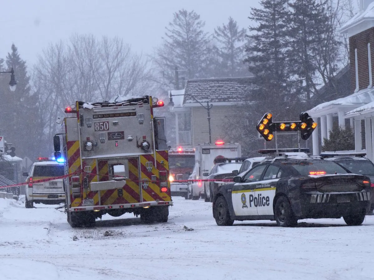 Police and fire officials block off a road as municipal officials say workers are missing after an explosion at a propane facility in St-Roch-de-l'Achigan, Que., north of Montreal on Jan.12, 2023. (The Canadian Press/Ryan Remiorz)
