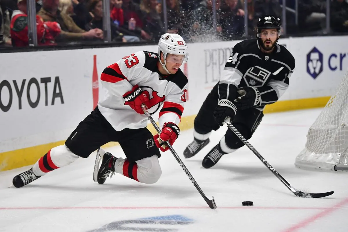 New Jersey Devils left wing Jesper Bratt (63) moves the puck against Los Angeles Kings center Phillip Danault (24) during the first period in Los Angeles on Jan. 14, 2023. (Gary A. Vasquez/USA TODAY Sports via Field Level Media)