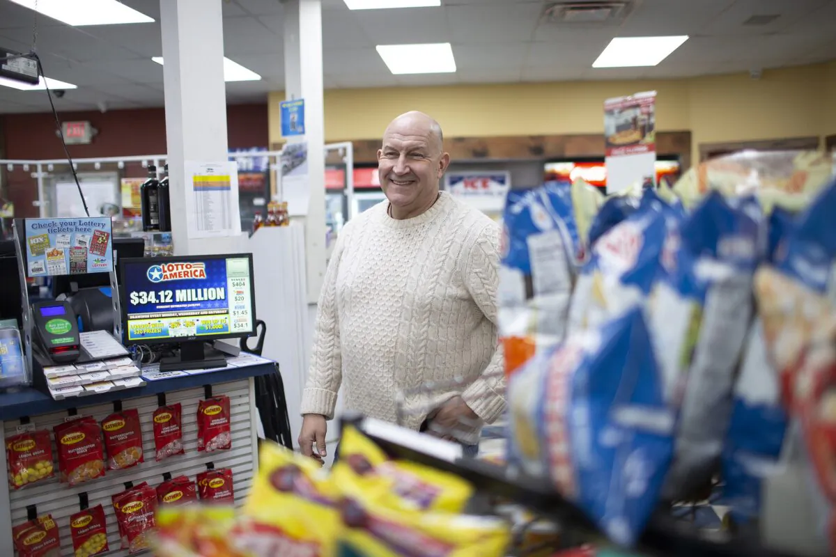 Hometown Gas & Grill owner Fred Cotreau greets customers in Lebanon, Maine, on Jan. 14, 2023. (Derek Davis/Portland Press Herald via AP)