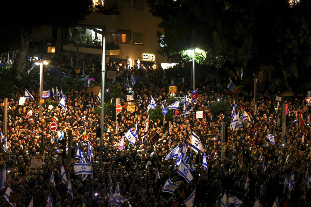 Israelis protest against the government and its proposed judicial reforms to reduce powers of the Supreme Court in a main square in Tel Aviv, Israel, on Jan. 14, 2023. (Ronen Zvulun/Reuters)