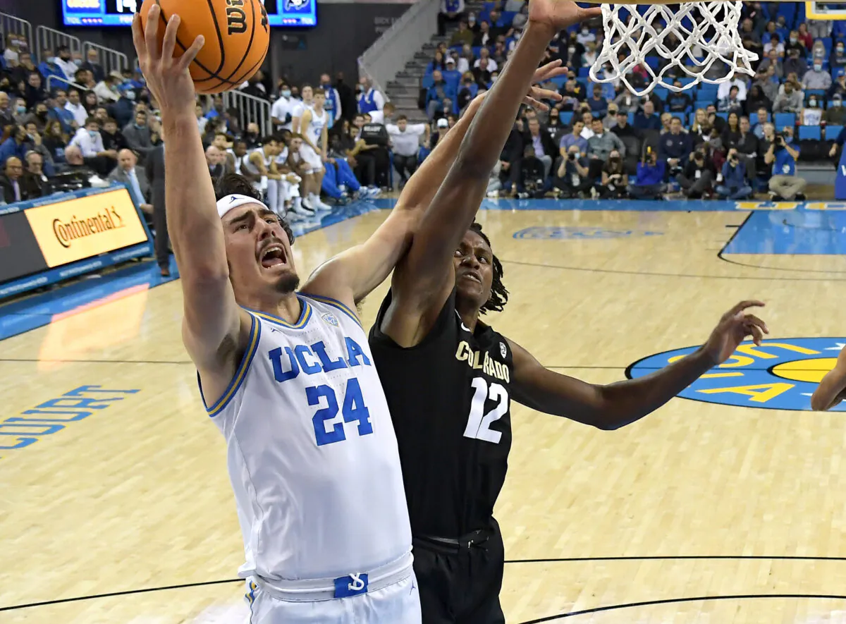 Jaime Jaquez Jr. (24) of the UCLA Bruins is fouled by Jabari Walker (12) of the Colorado Buffaloes as he goes up for a basket in the first half at UCLA Pauley Pavilion on Dec. 1, 2021 in Los Angeles, California. (Jayne Kamin-Oncea/Getty Images)