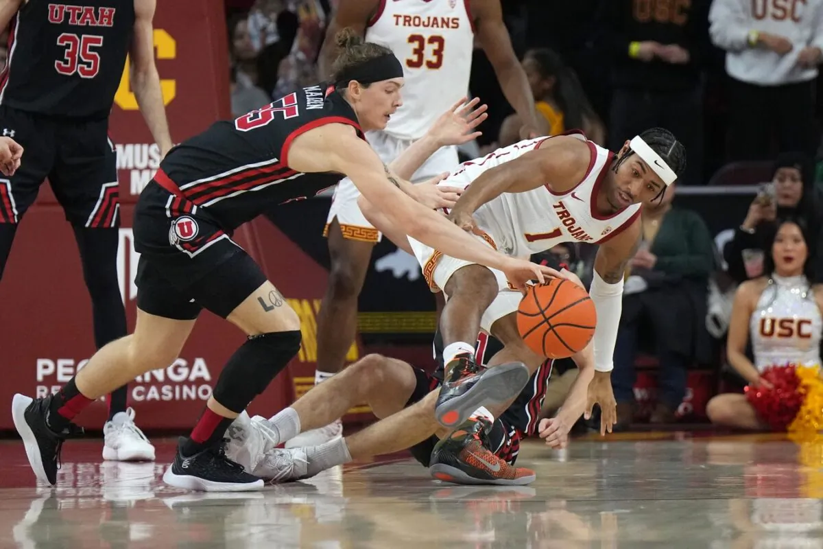 Southern California Trojans guard Malik Thomas (1) and Utah Utes guard Gabe Madsen (55) battle for the ball in the first half at Galen Center in Los Angeles on Jan. 14, 2023. (Kirby Lee/USA TODAY Sports via Field Level Media)