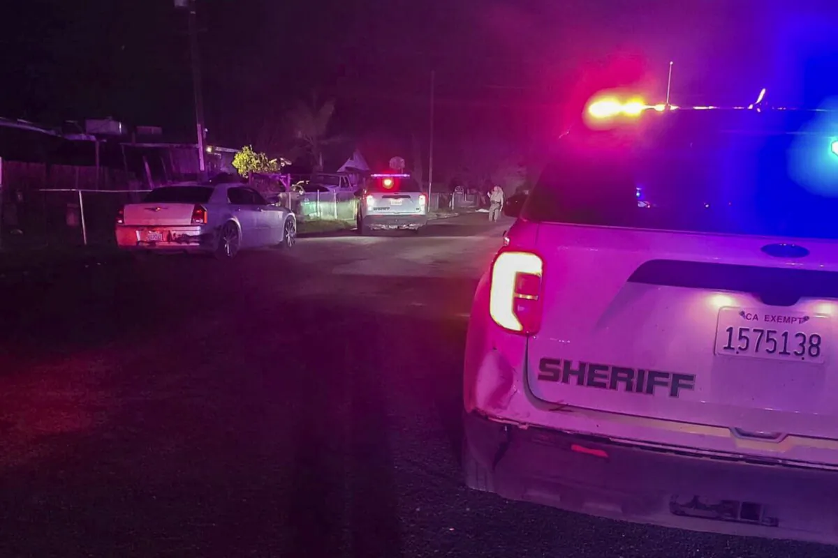 Detectives investigate a shooting in Goshen near Visalia, Calif., early on Jan. 16, 2023. (Tulare County Sheriff's Office via AP)