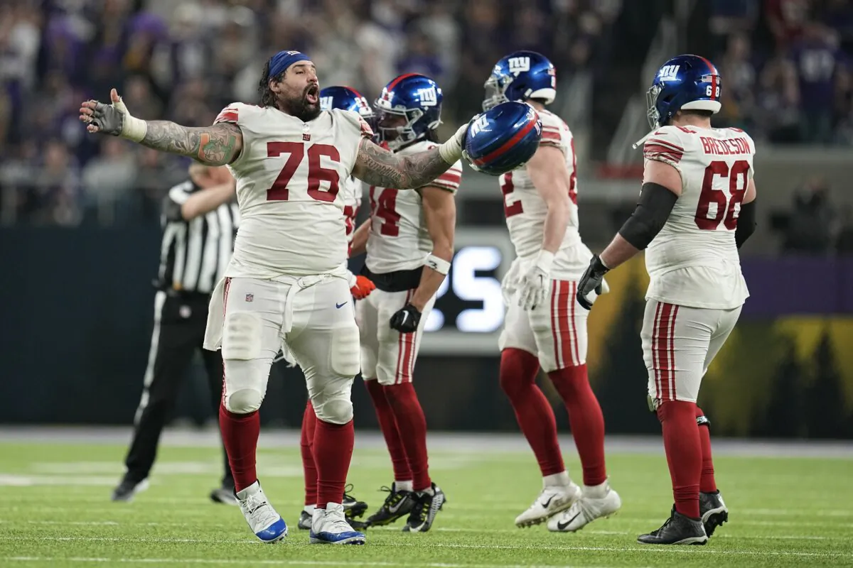 New York Giants players celebrate after the Minnesota Vikings failed to get a first down during the second half of an NFL wild card football game in Minneapolis on Jan. 15, 2023. (Abbie Parr/AP Photo)