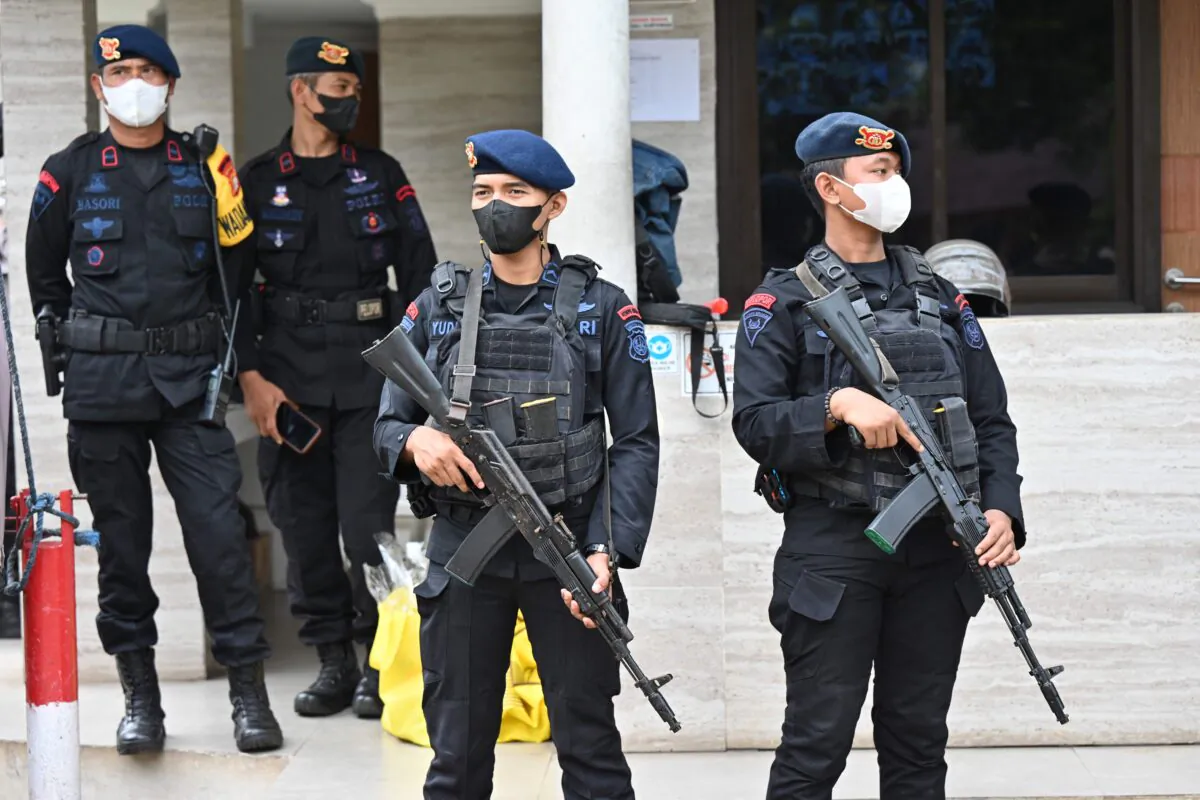 Mobile brigade police stand guard as they check security at the Immanuel church ahead of Christmas eve in Jakarta, Indonesia, on Dec. 24, 2022. (Adek Berry/AFP via Getty Images)