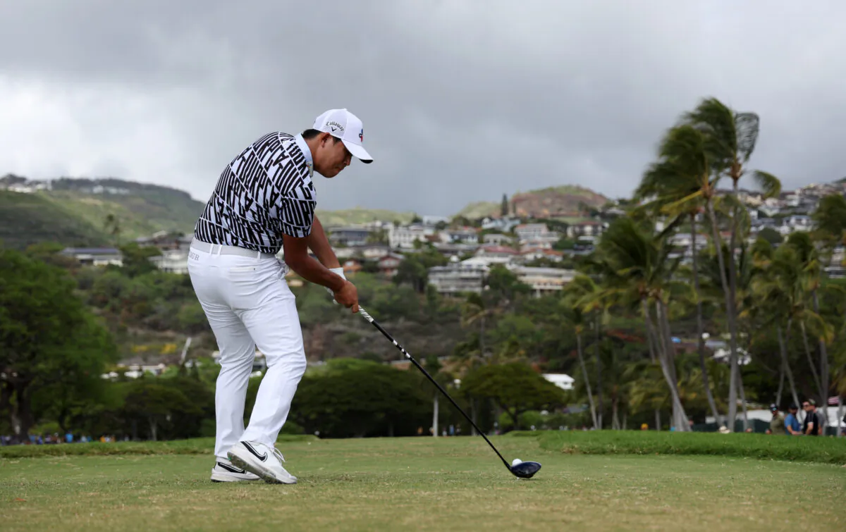 Si Woo Kim of South Korea plays his shot from the 14th tee during the final round of the Sony Open in Hawaii at Waialae Country Club in Honolulu, on January 15, 2023. (Harry How/Getty Images)