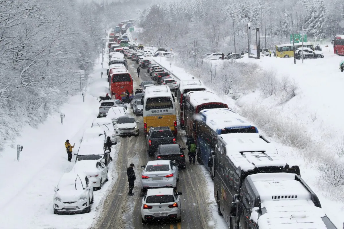 Vehicles are stuck on a highway in heavy snow in Pyeongchang, about 126 kilometers (78 miles) east of Seoul, South Korea, on Jan. 15, 2023. (Yoo Hyung-je/Yonhap via AP)