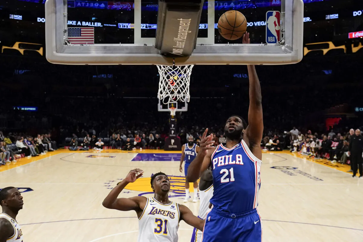 Philadelphia 76ers center Joel Embiid (21) shoots against Los Angeles Lakers center Thomas Bryant (31) during the first half of an NBA basketball game in Los Angeles on Jan. 15, 2023. (Ashley Landis/AP Photo)