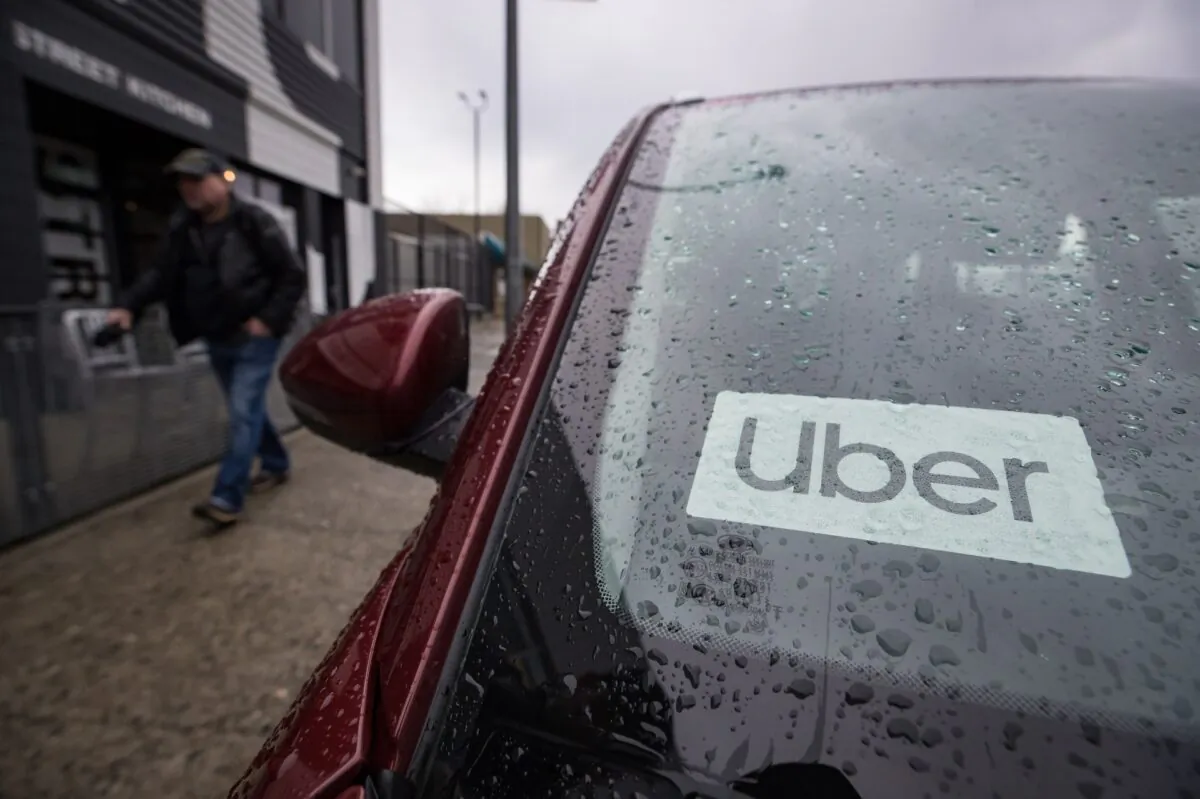 An Uber driver's vehicle is seen in Vancouver on Jan. 24, 2020. (Darryl Dyck/The Canadian Press)