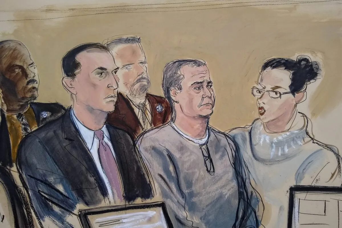Defense attorney Cesar de Castro (L), Mexico's former top security official Genaro Garcia Luna (C), and a court interpreter appear for an arraignment hearing in Brooklyn federal court in New York on Jan. 3, 2020. (Elizabeth Williams/AP Photo)
