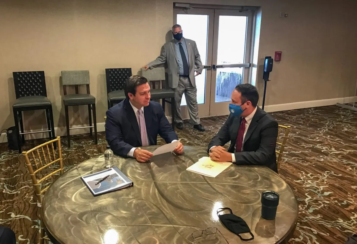 Florida Gov. Ron DeSantis speaks with David Kerner, then-mayor of Palm Beach County, Fla., during a national Fraternal Order of Police leadership gathering in Atlantic Beach, Fla., in September 2020. (Courtesy of Palm Beach County)