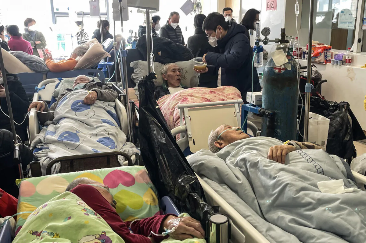 Patients on stretchers are seen at Tongren hospital in Shanghai on January 3, 2023. (Hector Retamal /AFP via Getty Images)